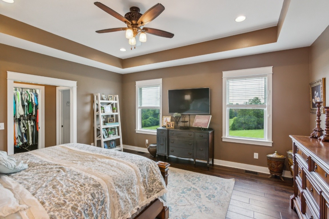 215 George Akins Road Westmoreland, TN 37186 - Photo 20 of 39 a bedroom with a bed and a large window with chair