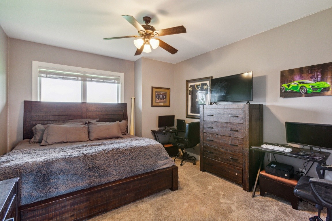 215 George Akins Road Westmoreland, TN 37186 - Photo 26 of 39 a bedroom with a bed and a flat screen tv