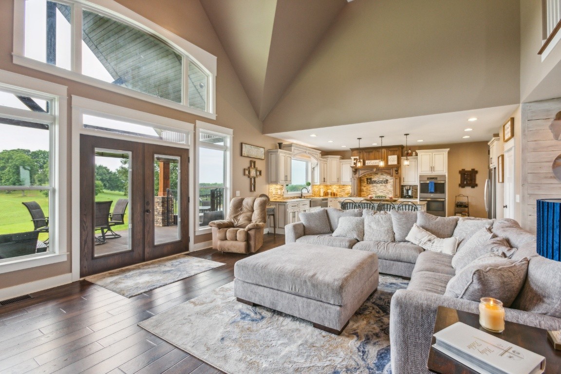 215 George Akins Road Westmoreland, TN 37186 - Photo 10 of 39 a living room with furniture floor to ceiling window and wooden floor