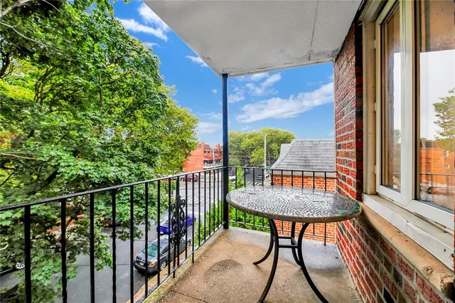 a view of a balcony with furniture