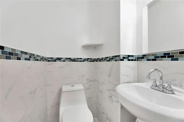 a bathroom with a sink and mirror