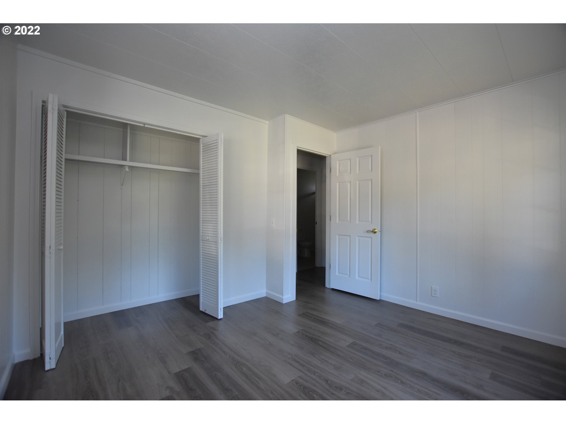 1629 Harbor Drive Springfield, OR 97477 - Photo 13 of 32 a view of an empty room with wooden floor