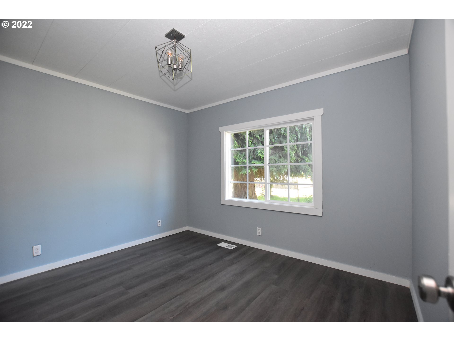 1629 Harbor Drive Springfield, OR 97477 - Photo 15 of 32 a view of an empty room with wooden floor and a window