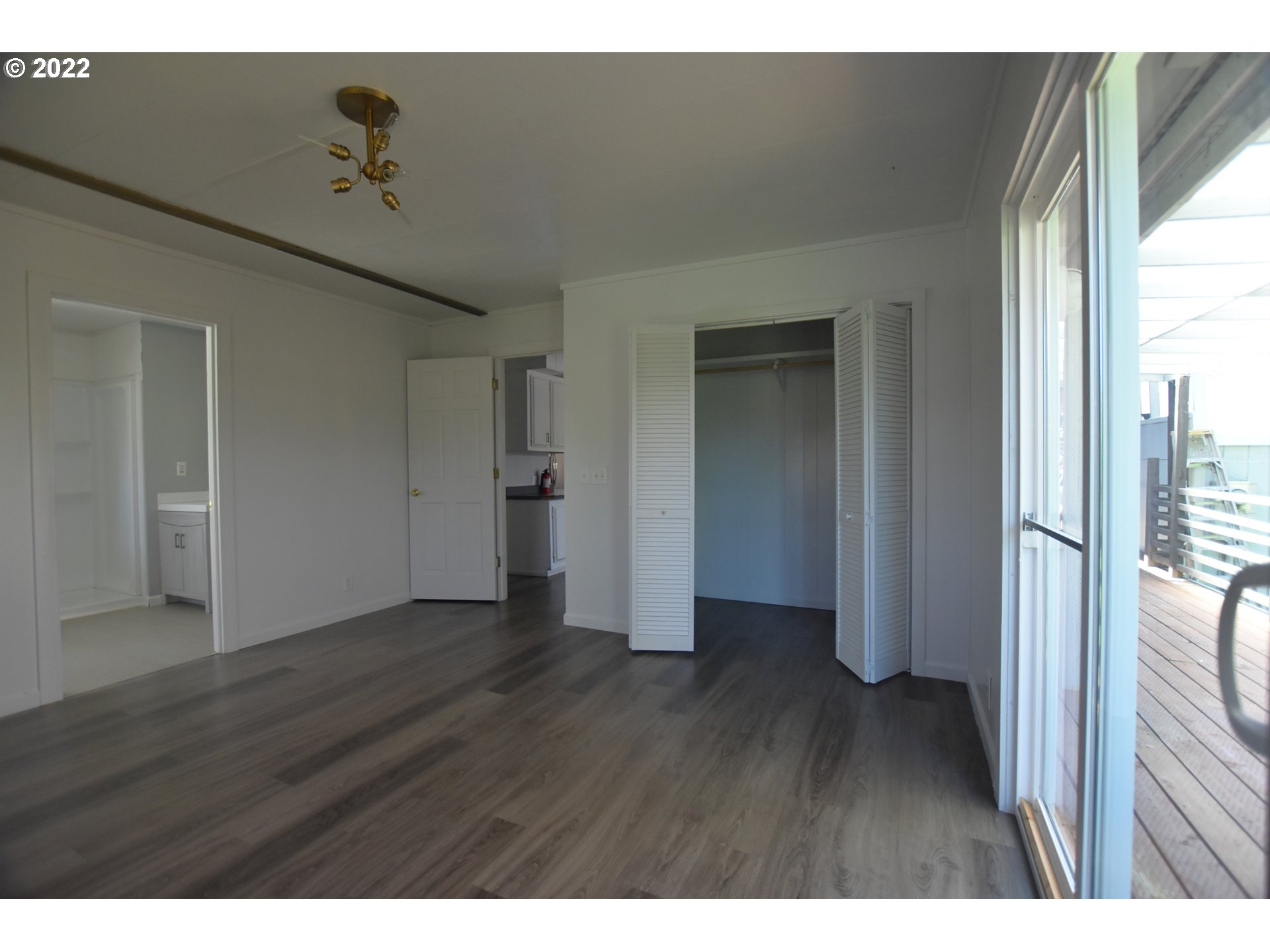1629 Harbor Drive Springfield, OR 97477 - Photo 20 of 32 a view of an empty room with wooden floor and a window