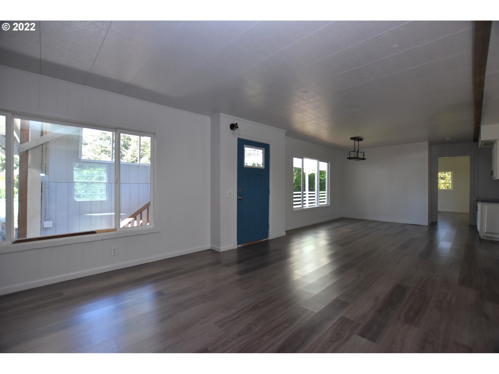 1629 Harbor Drive Springfield, OR 97477 - Photo 4 of 32 a view of an empty room with wooden floor and a window