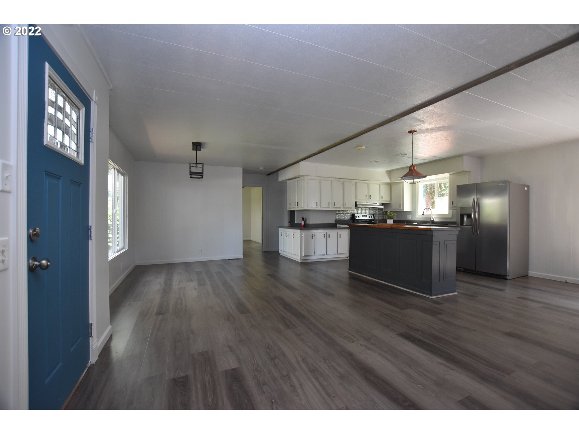 1629 Harbor Drive Springfield, OR 97477 - Photo 5 of 32 a view of a kitchen with a sink cabinets and a living room