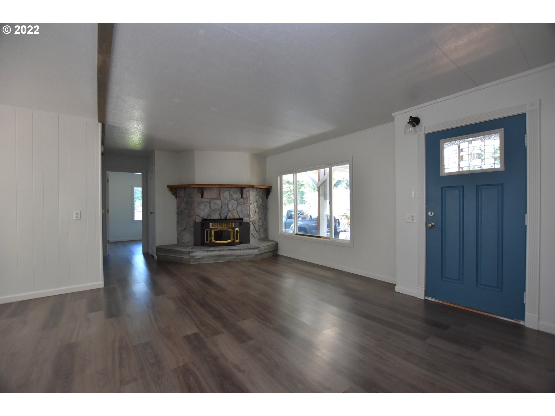 1629 Harbor Drive Springfield, OR 97477 - Photo 10 of 32 a view of empty room with fireplace and wooden floor