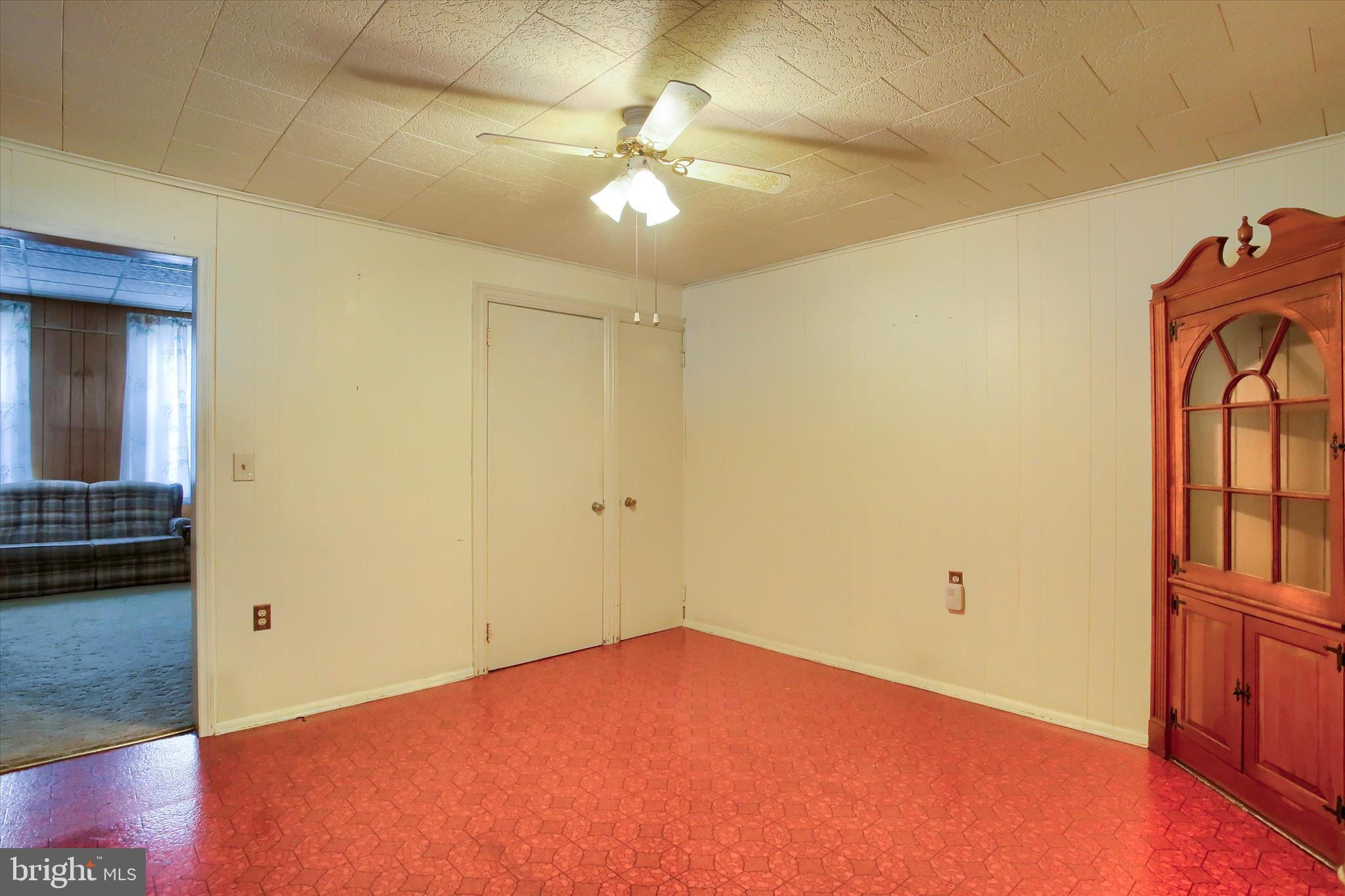 636 Walnut Street Lebanon, PA 17042 - Photo 11 of 33 wooden floor in an empty room and a chandelier fan