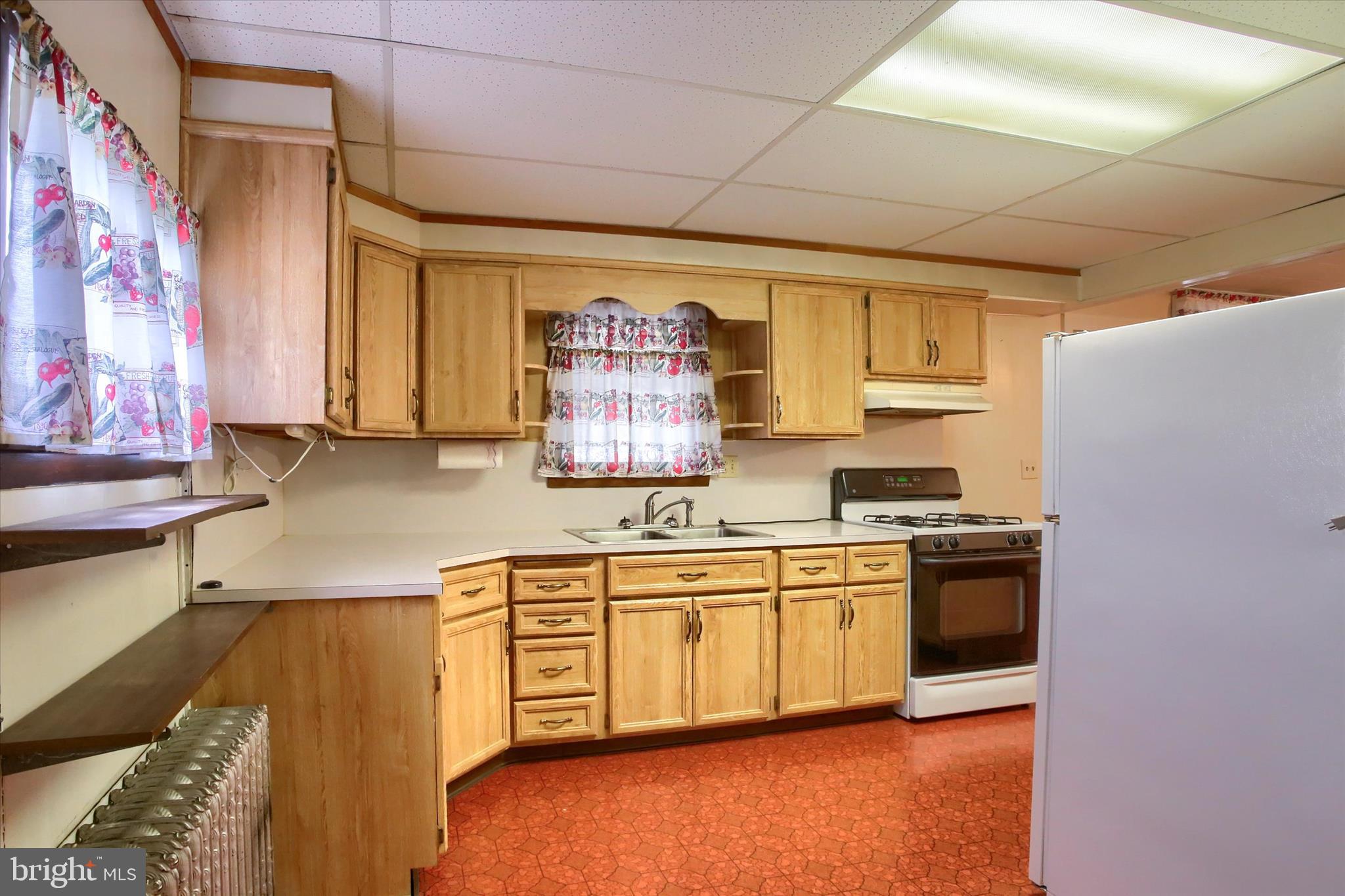 636 Walnut Street Lebanon, PA 17042 - Photo 13 of 33 a kitchen with stainless steel appliances granite countertop a stove and a sink