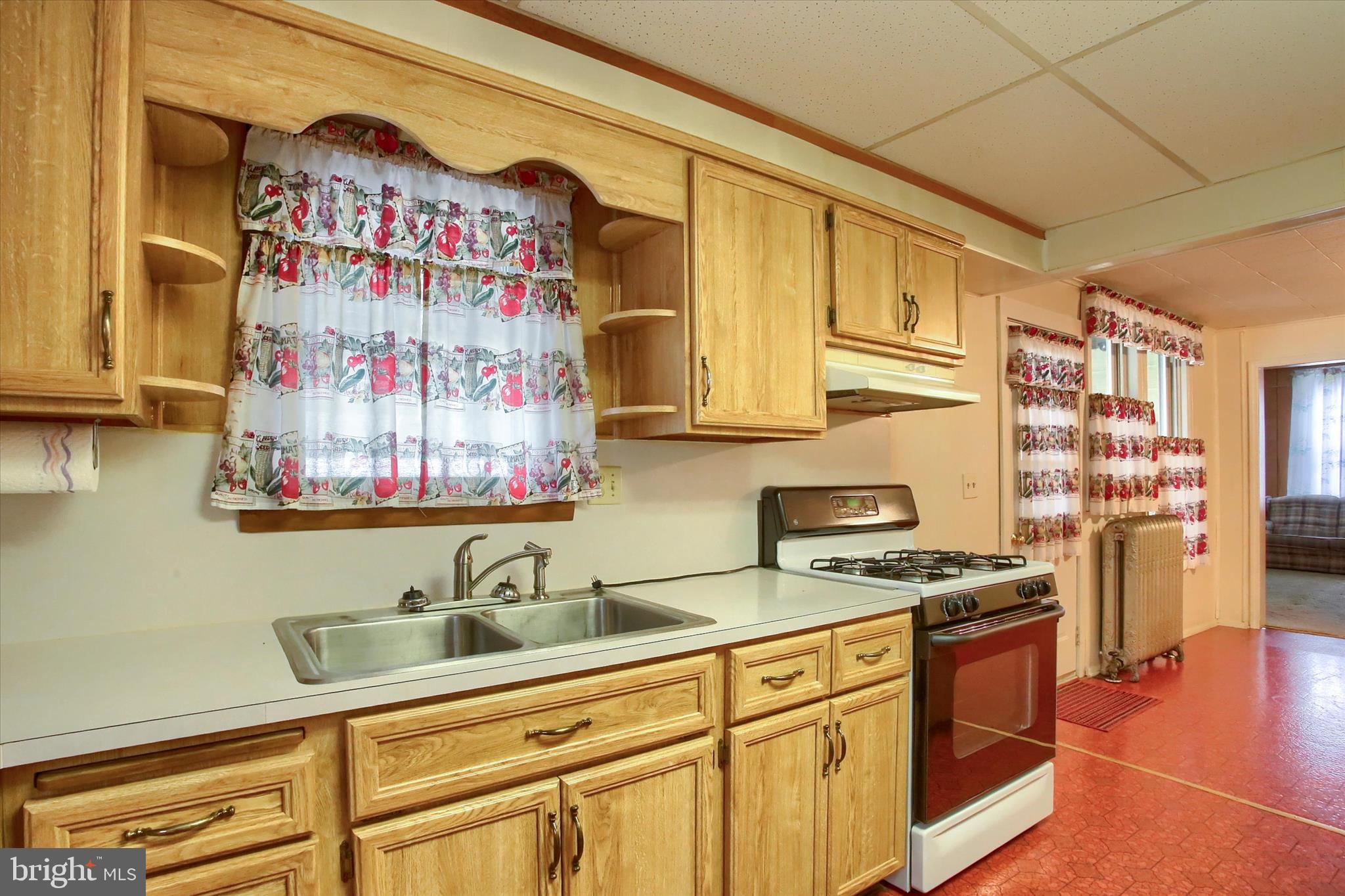 636 Walnut Street Lebanon, PA 17042 - Photo 15 of 33 a kitchen with stainless steel appliances a stove a sink and a refrigerator