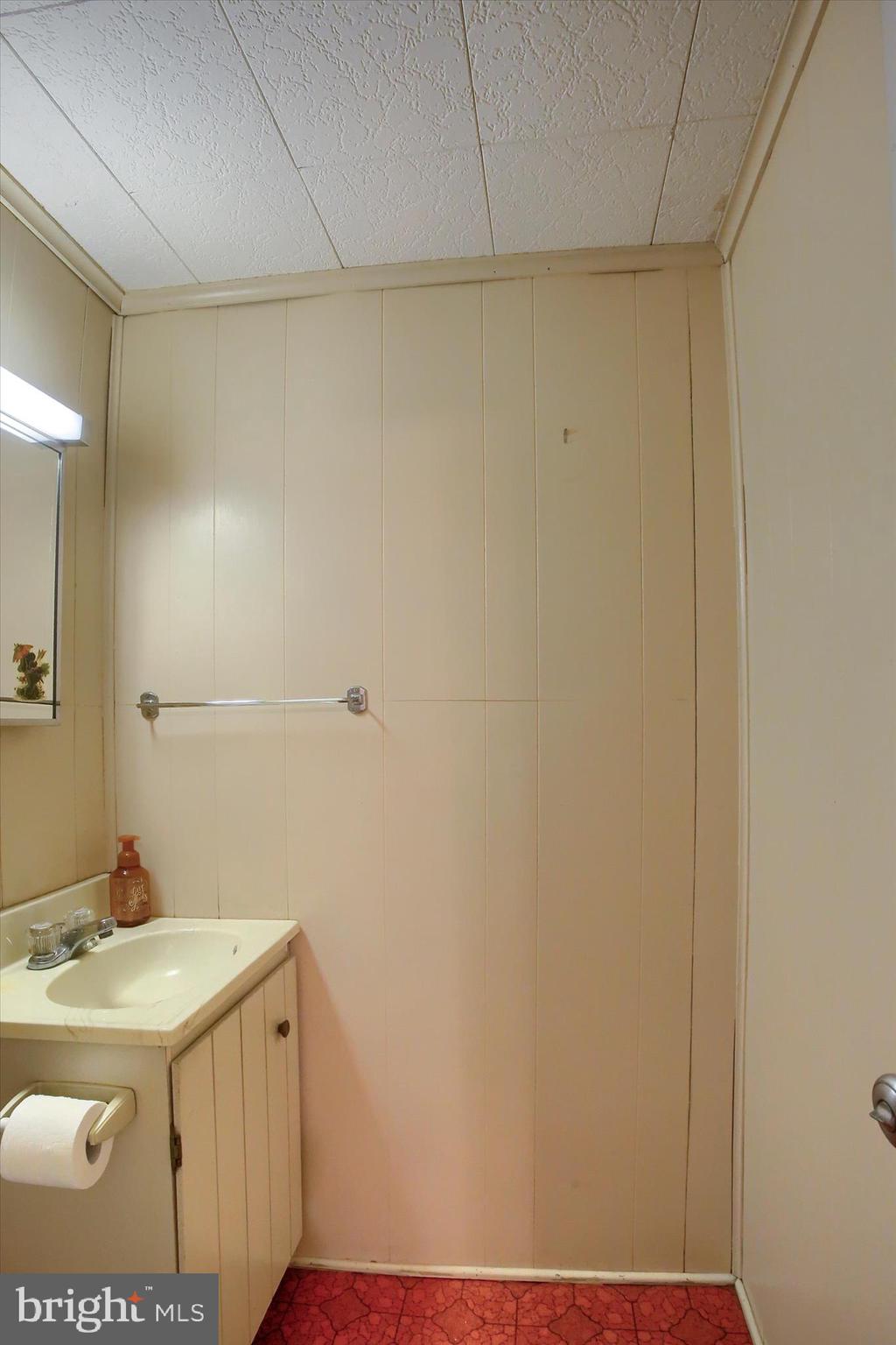 636 Walnut Street Lebanon, PA 17042 - Photo 16 of 33 a bathroom with a sink and a mirror