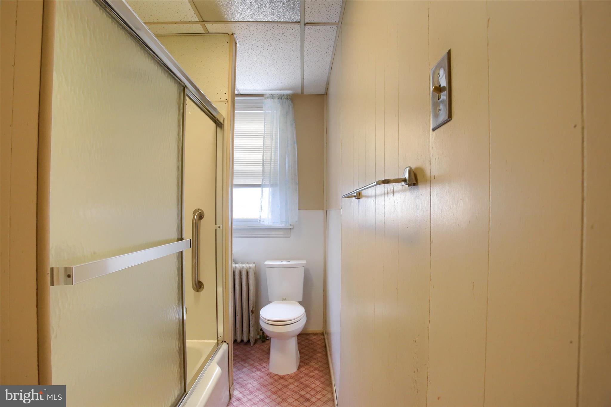 636 Walnut Street Lebanon, PA 17042 - Photo 21 of 33 a bathroom with a granite countertop shower and a toilet
