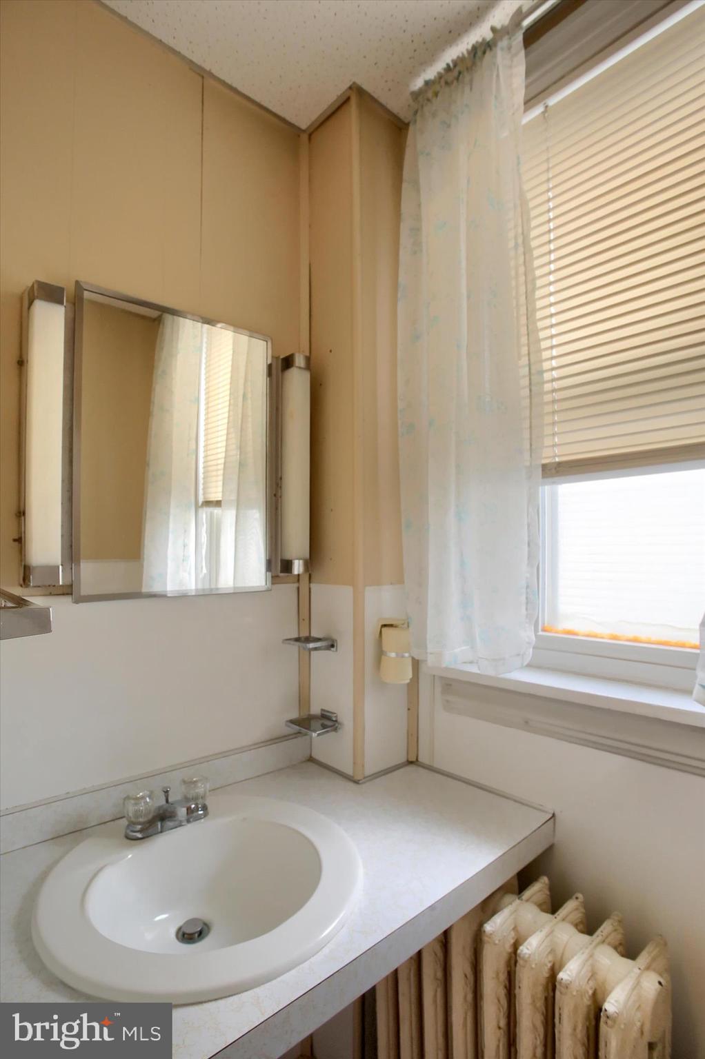 636 Walnut Street Lebanon, PA 17042 - Photo 22 of 33 a bathroom with a sink and a mirror