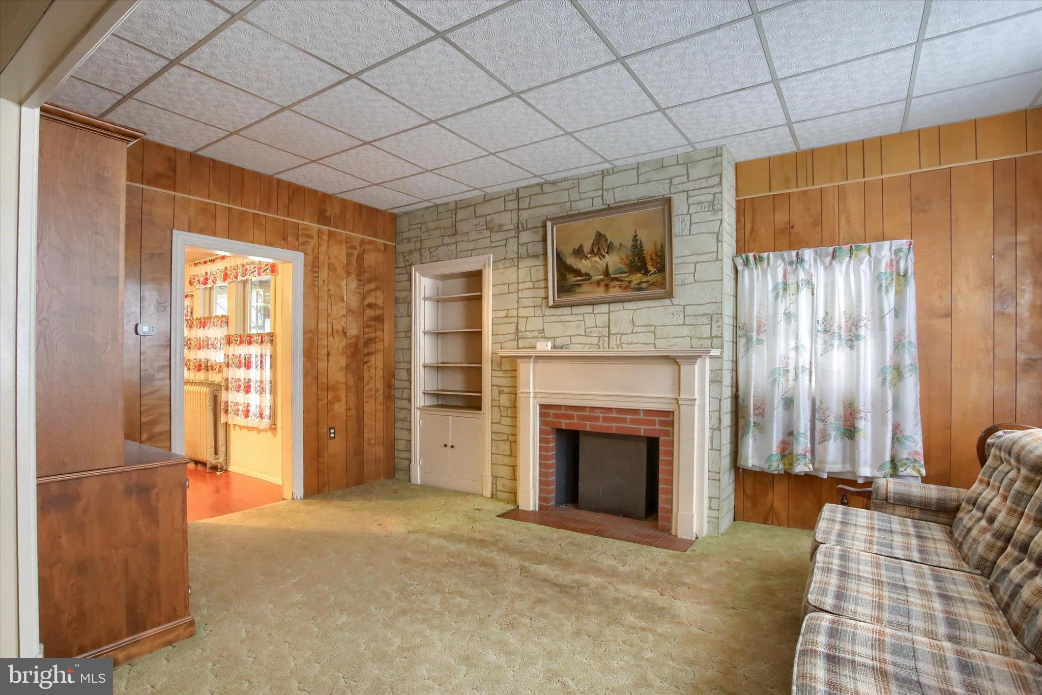 636 Walnut Street Lebanon, PA 17042 - Photo 7 of 33 a living room with furniture and a fireplace