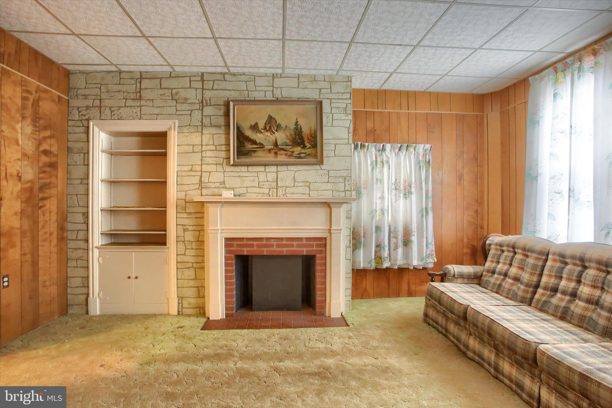 636 Walnut Street Lebanon, PA 17042 - Photo 8 of 33 a living room with furniture and a fireplace