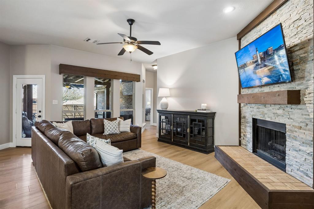 3917 Gatewick Drive Rockwall, TX 75087 - Photo 8 of 34 a living room with furniture and a fireplace