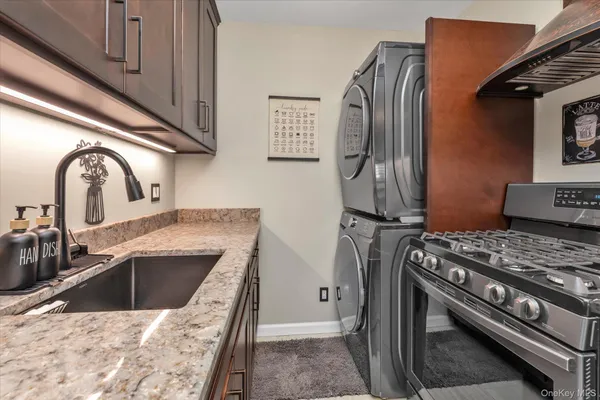 a kitchen with a stove and a sink