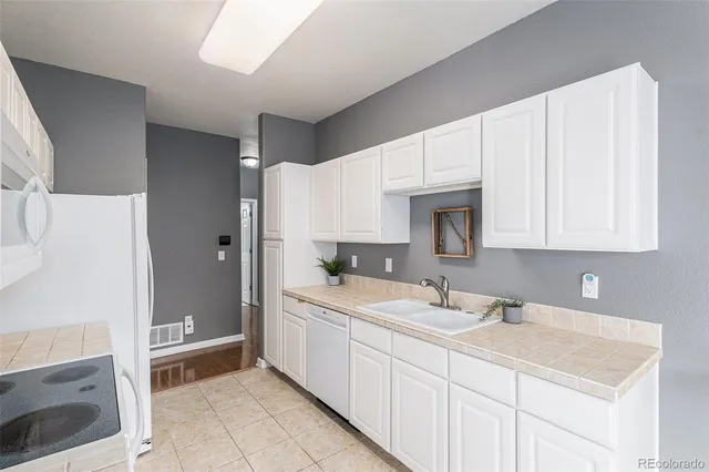 a spacious bathroom with a sink double vanity and a mirror
