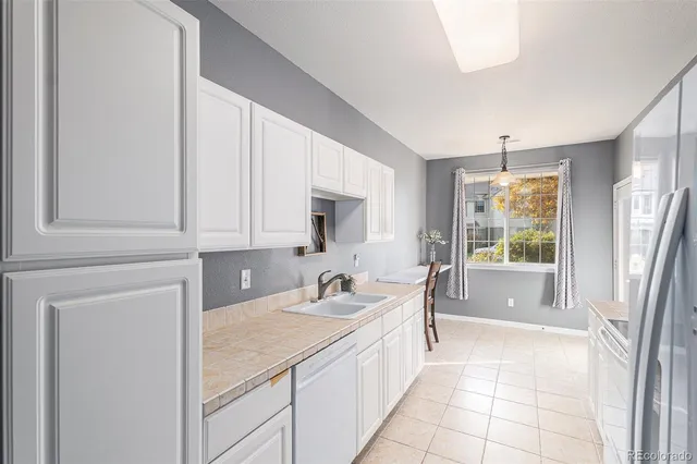 a bathroom with a sink a mirror and a bathtub