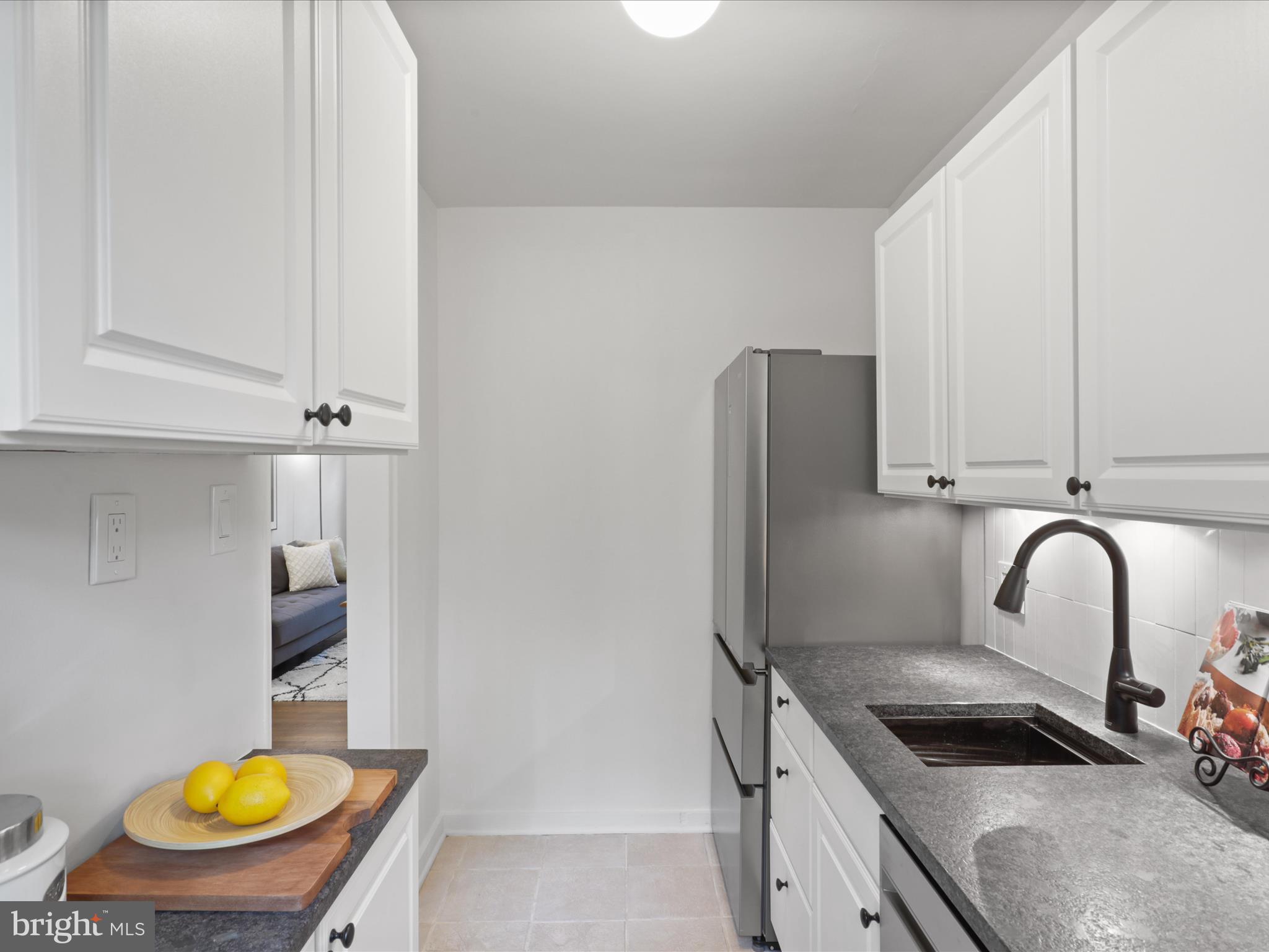 9 East Glebe Road, Unit C Alexandria, VA 22305 - Photo 15 of 38 a kitchen with a sink a stove and a refrigerator