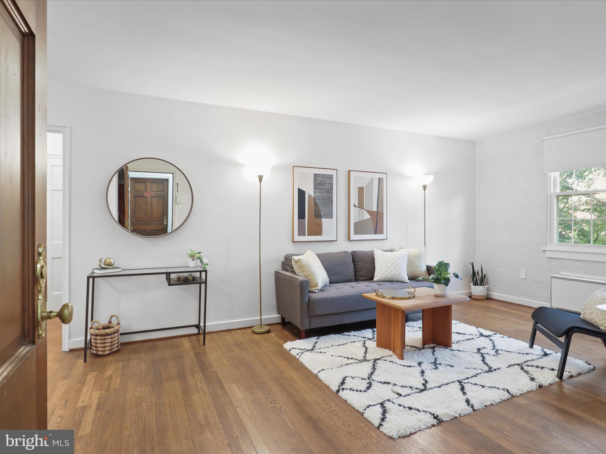 9 East Glebe Road, Unit C Alexandria, VA 22305 - Photo 4 of 38 a living room with furniture and a wooden floor