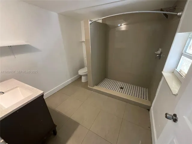 a bathroom with a sink and toilet