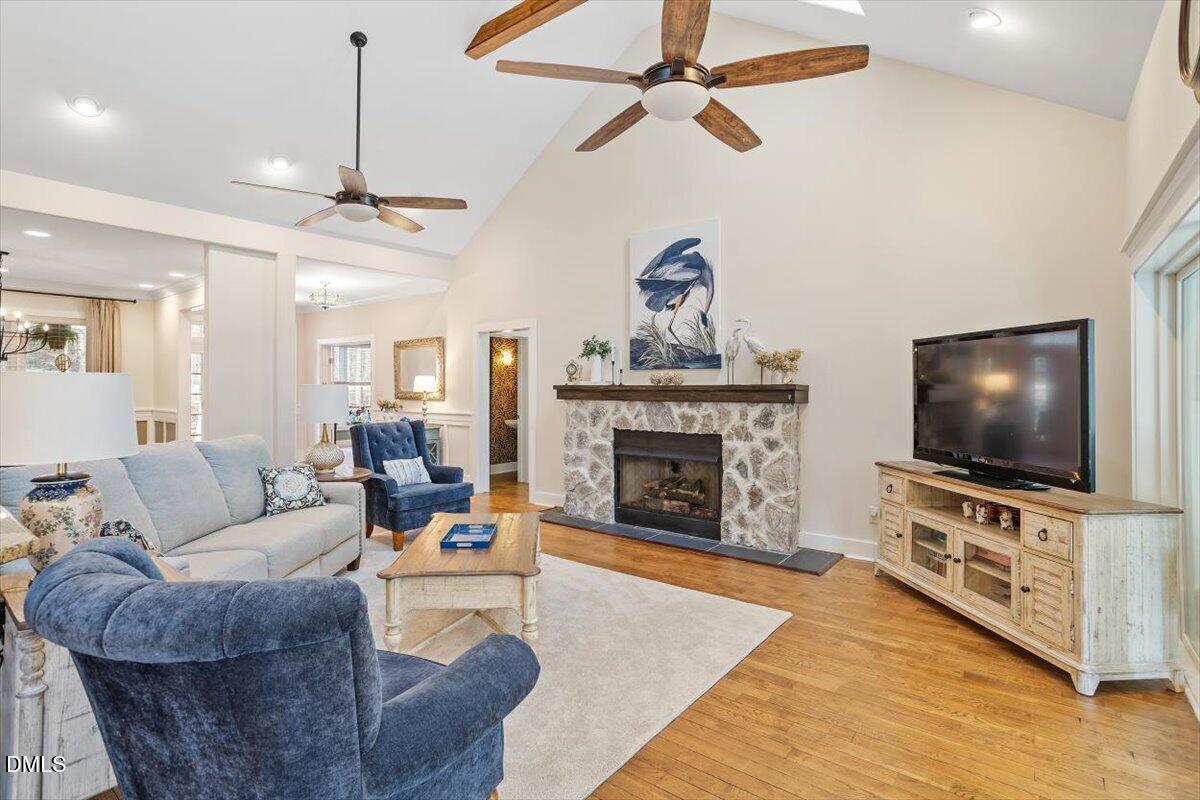 31 River View Court Timberlake, NC 27583 - Photo 14 of 44 a living room with furniture a flat screen tv and a fireplace