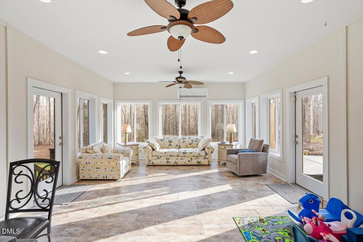 31 River View Court Timberlake, NC 27583 - Photo 16 of 44 a living room with furniture and a large window