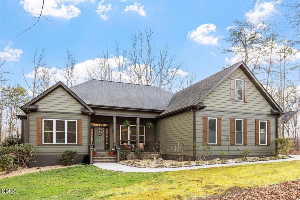 31 River View Court Timberlake, NC 27583 - Photo 2 of 44 a front view of a house with a yard outdoor seating and yard