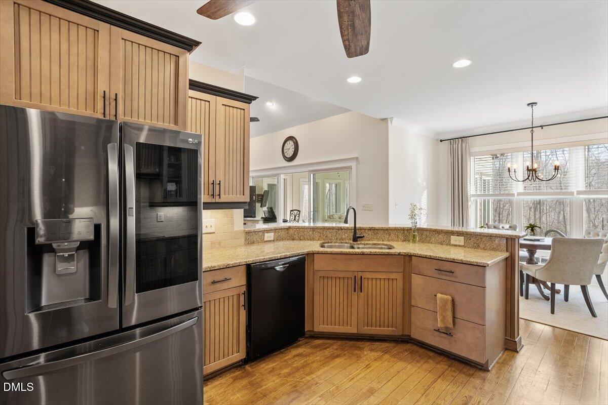 31 River View Court Timberlake, NC 27583 - Photo 21 of 44 a kitchen with stainless steel appliances granite countertop a refrigerator a sink a stove and a refrigerator