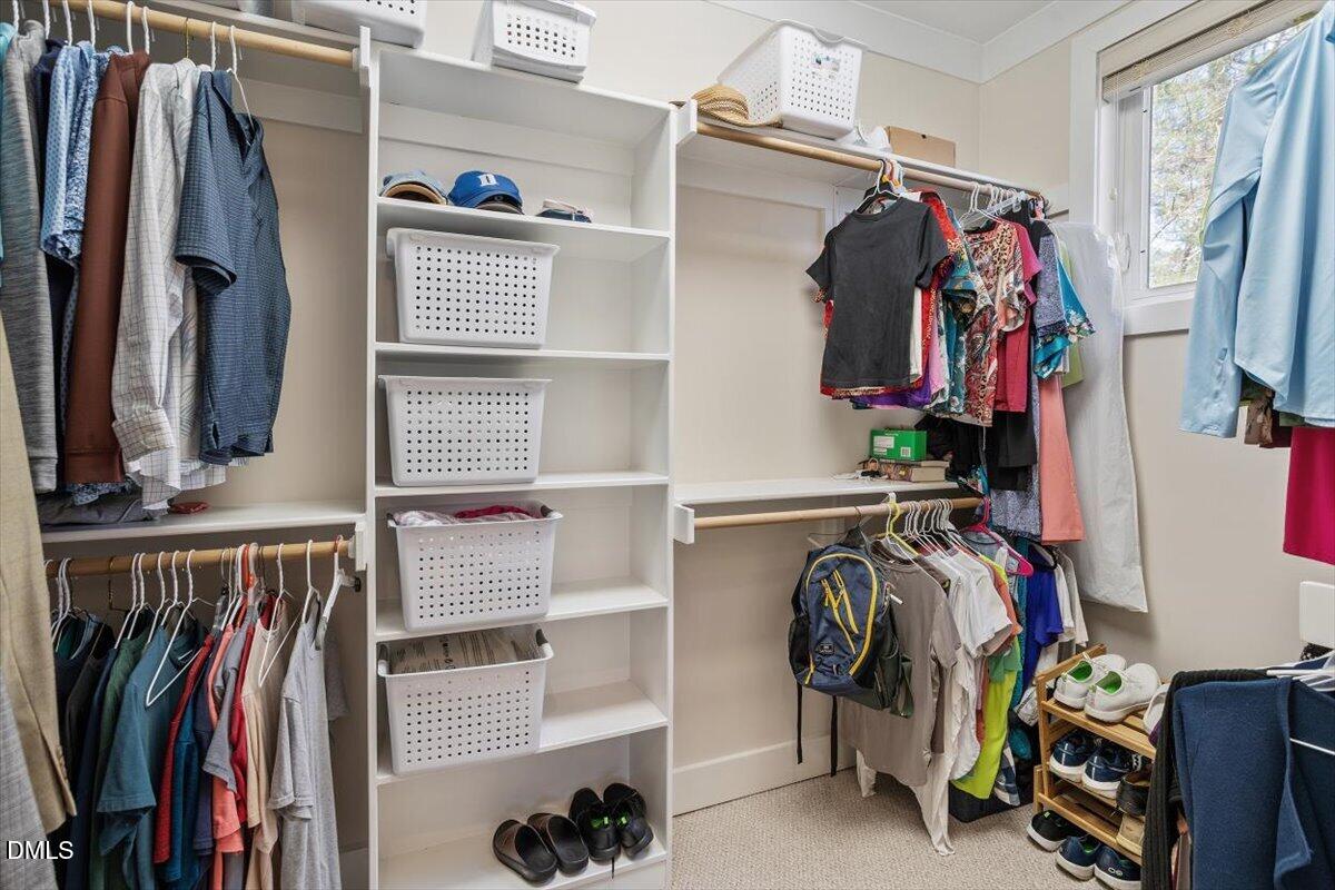 31 River View Court Timberlake, NC 27583 - Photo 27 of 44 a view of walk in closet with clothes and shoes