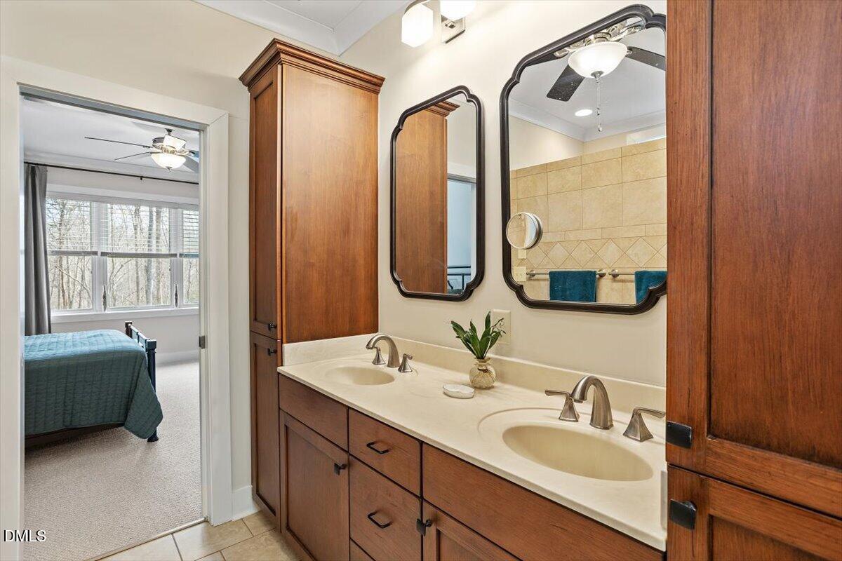 31 River View Court Timberlake, NC 27583 - Photo 28 of 44 a en suite bathroom with a double vanity sink and a mirror