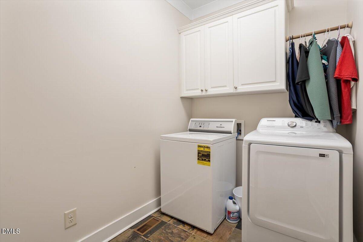 31 River View Court Timberlake, NC 27583 - Photo 33 of 44 a utility room with dryer and washer