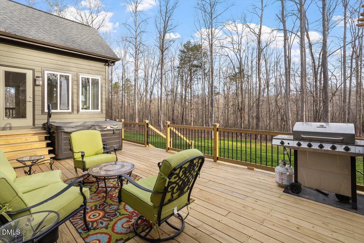 31 River View Court Timberlake, NC 27583 - Photo 34 of 44 a view of a patio with a table chairs and a backyard