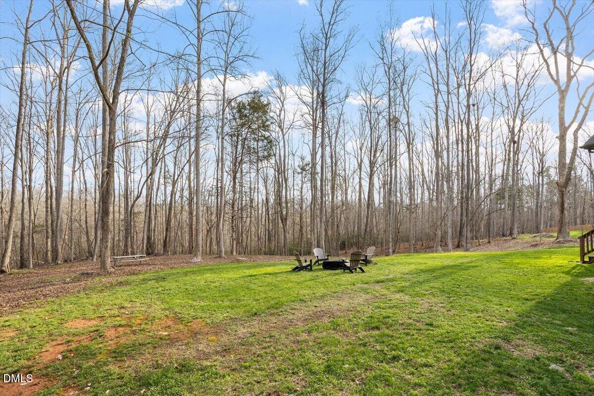 31 River View Court Timberlake, NC 27583 - Photo 39 of 44 a garden with trees in front of it