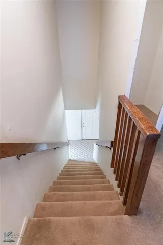 a view of bathroom with bathtub and stairs