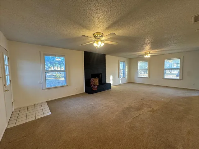 a view of a livingroom with a fireplace