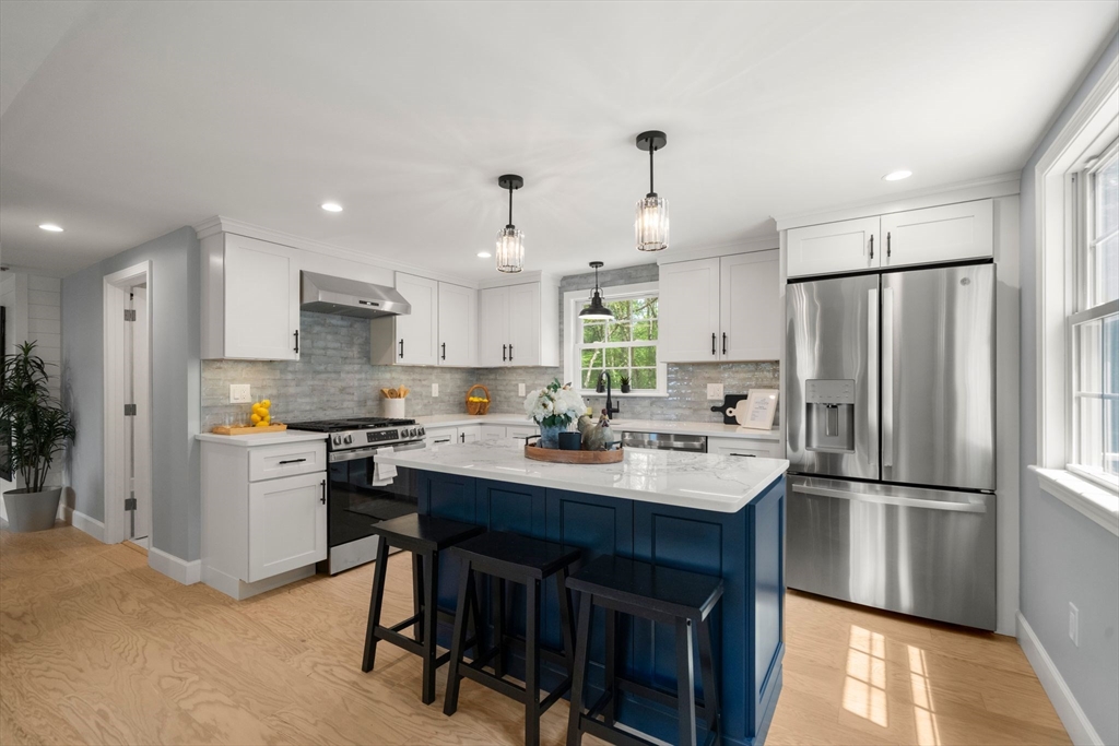 16 Churchill Road Plympton, MA 02367 - Photo 5 of 42 a kitchen with refrigerator a sink and white cabinets