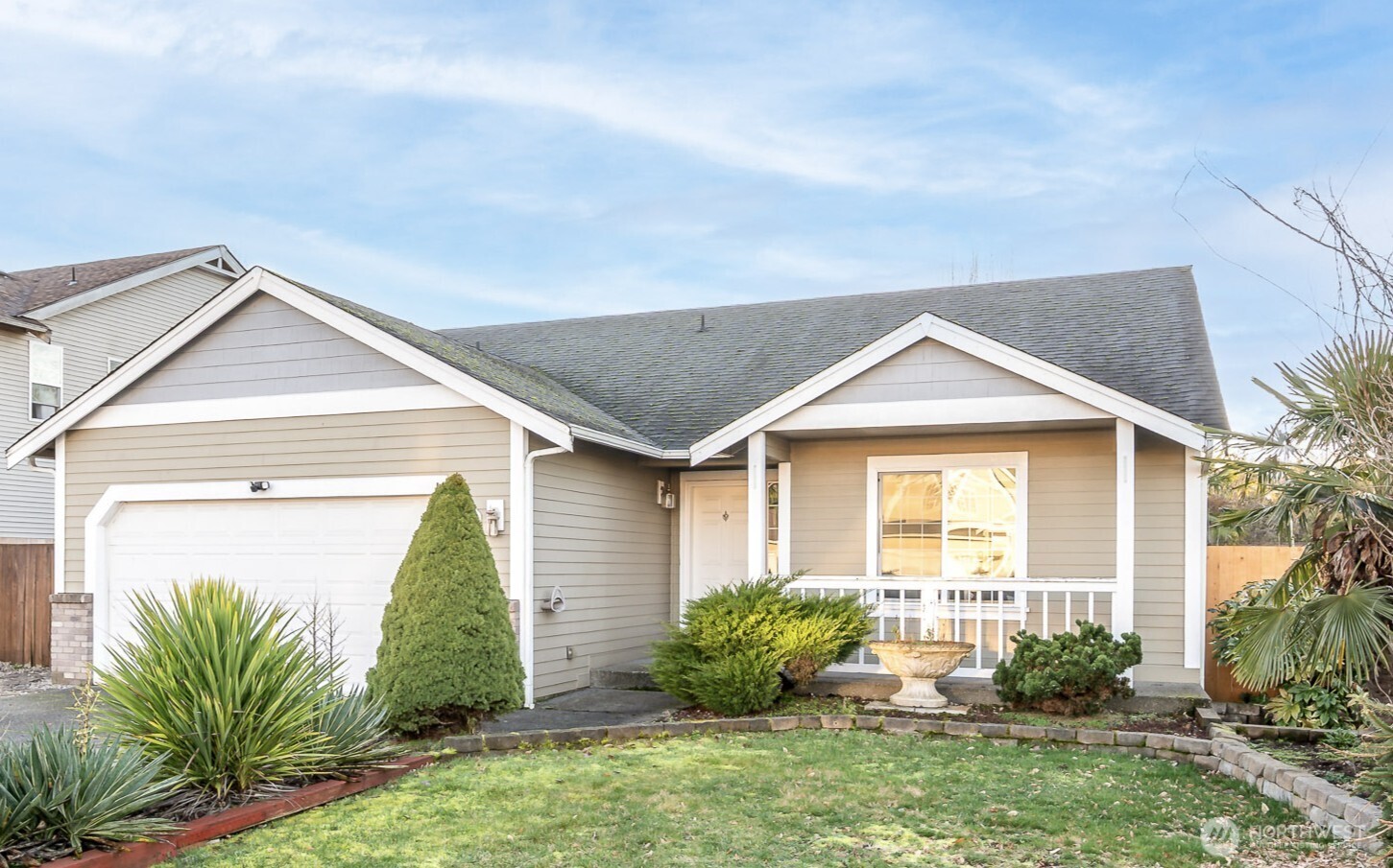 a front view of a house with garden