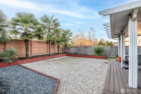 a view of backyard with patio