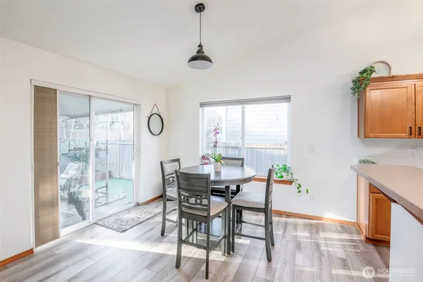 a view of a dining room with furniture window and wooden floor
