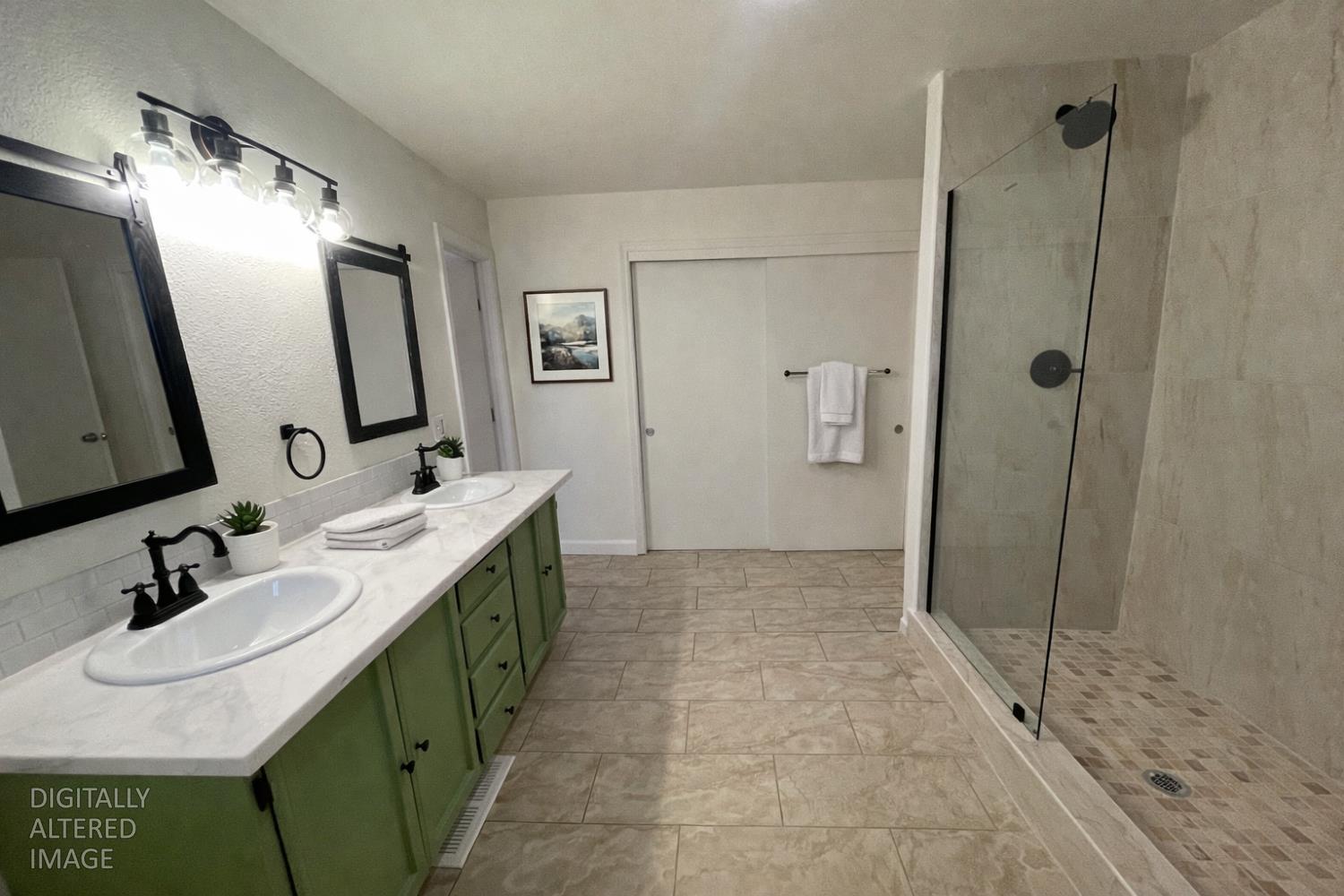 581 Haines Road Auburn, CA 95602 - Photo 8 of 52 Primary bathroom has new custom stylish large walk-in shower, vanity with double sinks and marble counters, new fixtures, tasteful colors and another closet.