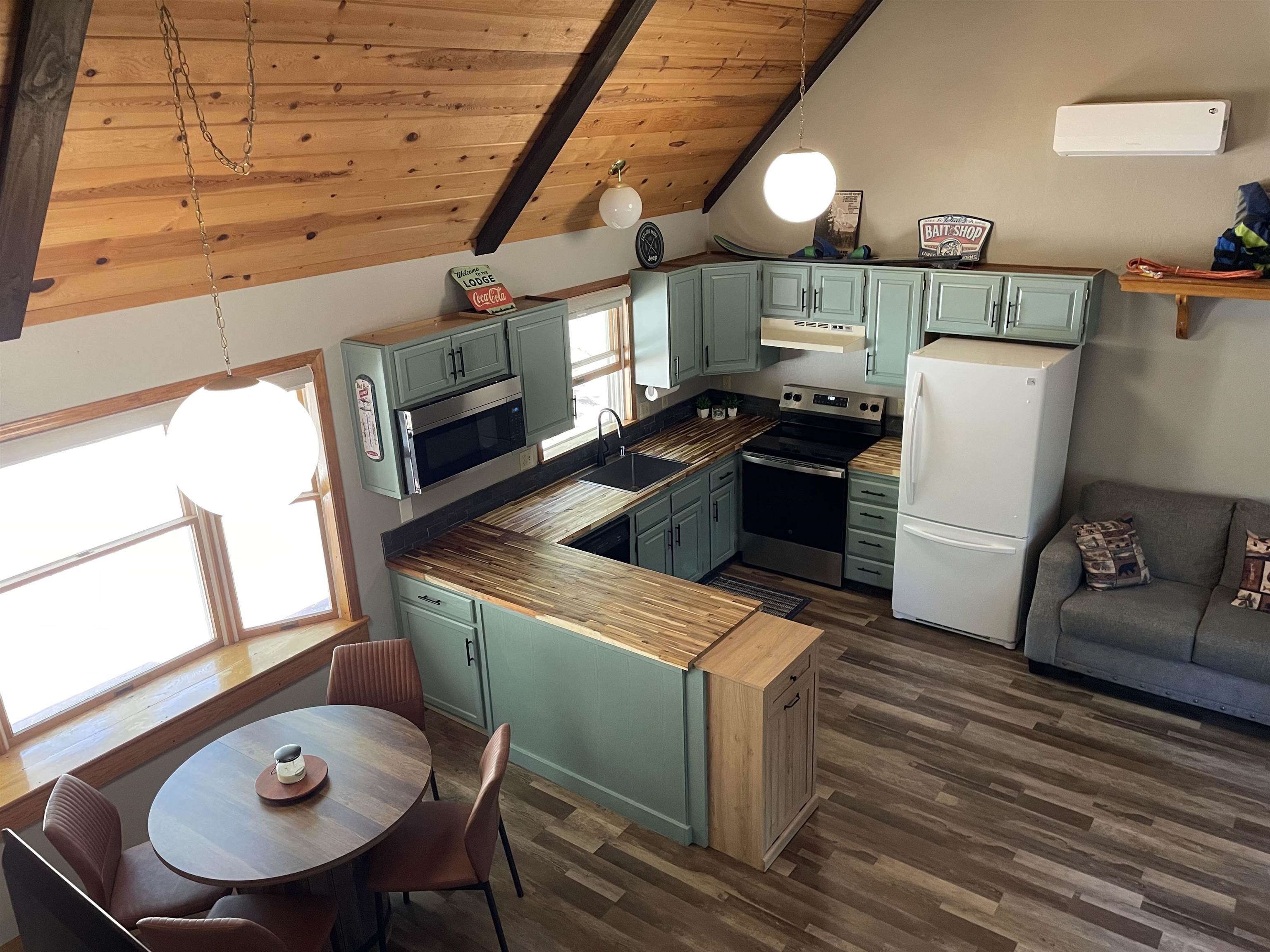 603 East Burnt Cedar Road Lake Almanor, CA 96137 - Photo 16 of 33 a kitchen with furniture and a fireplace