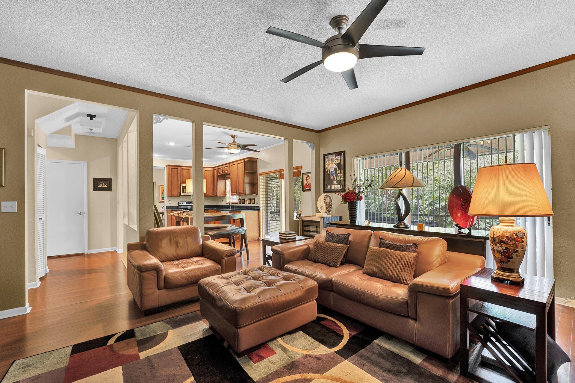 22211 Clocktower Way Boca Raton, FL 33428 - Photo 13 of 38 a living room with furniture and a lamp