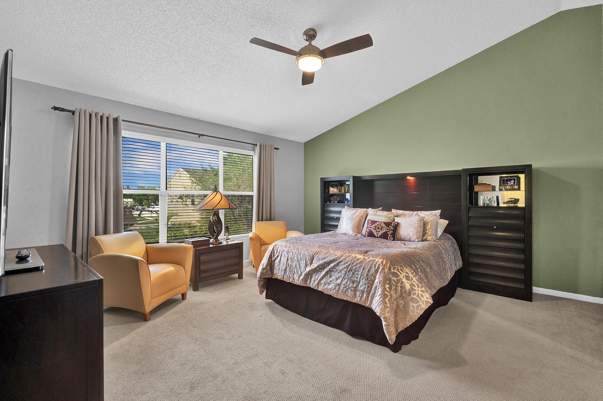 22211 Clocktower Way Boca Raton, FL 33428 - Photo 18 of 38 a bedroom with a bed and a couch