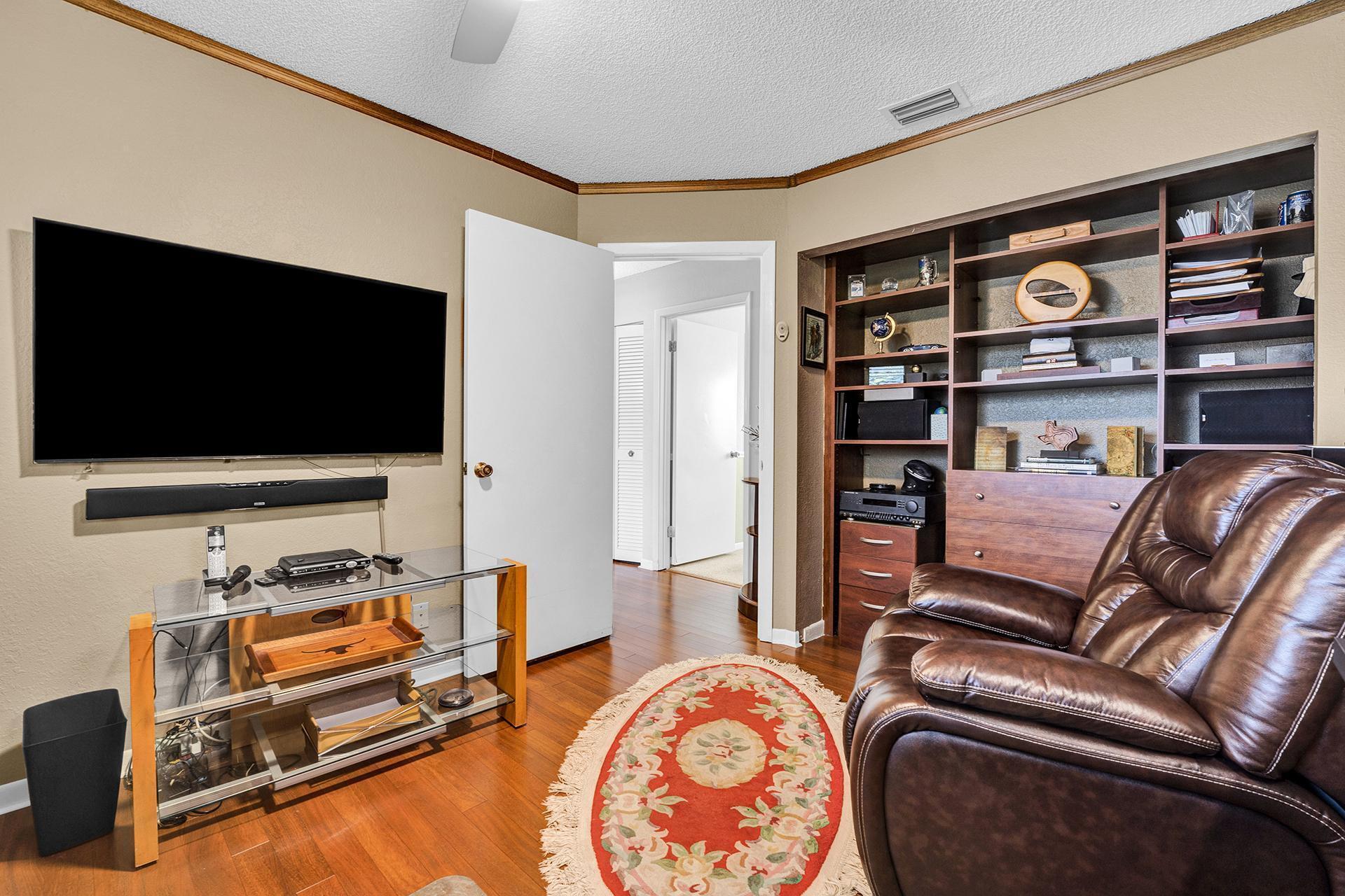 22211 Clocktower Way Boca Raton, FL 33428 - Photo 20 of 38 a living room with furniture and a flat screen tv