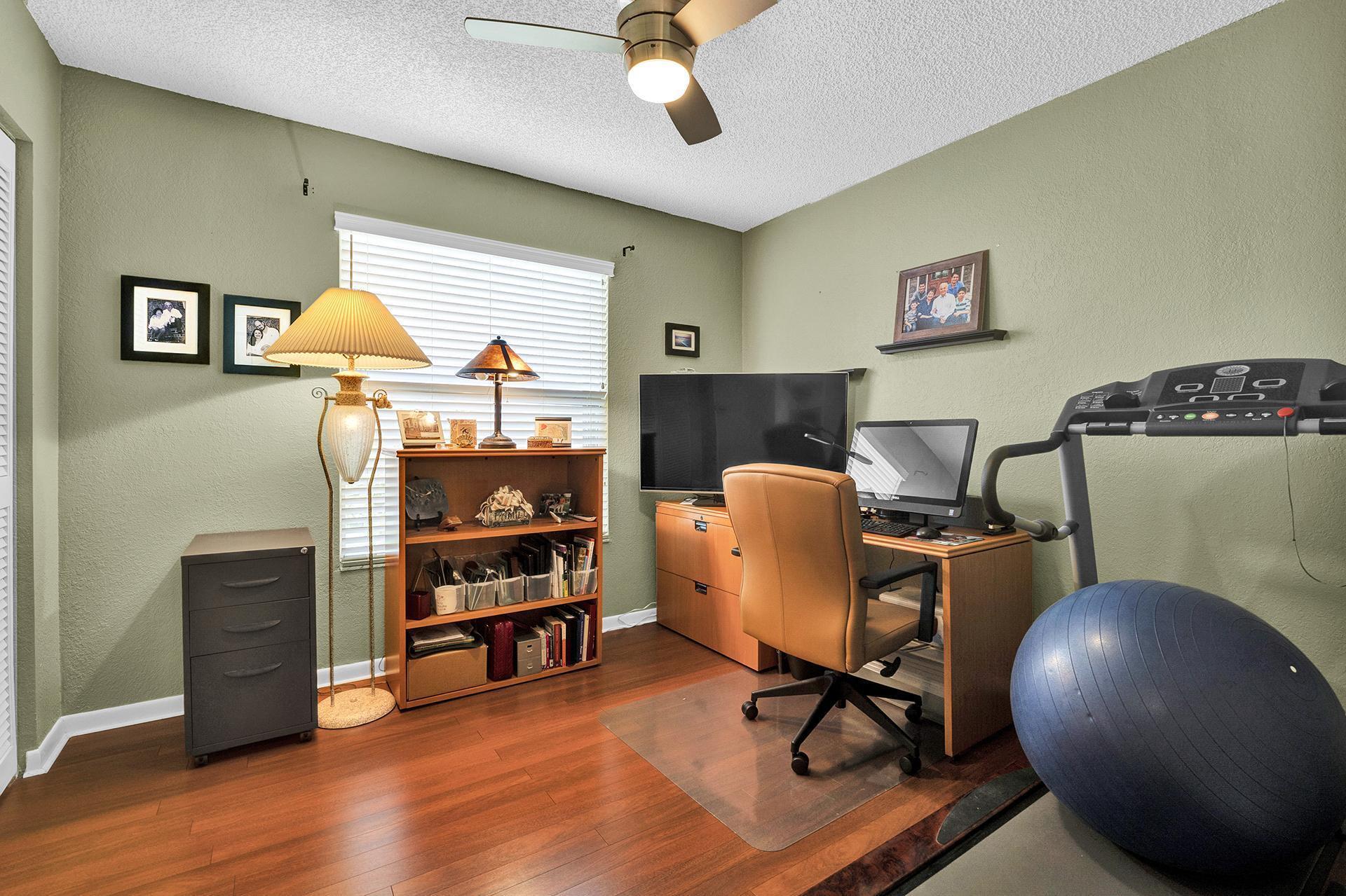 22211 Clocktower Way Boca Raton, FL 33428 - Photo 22 of 38 a workspace with furniture and lamp