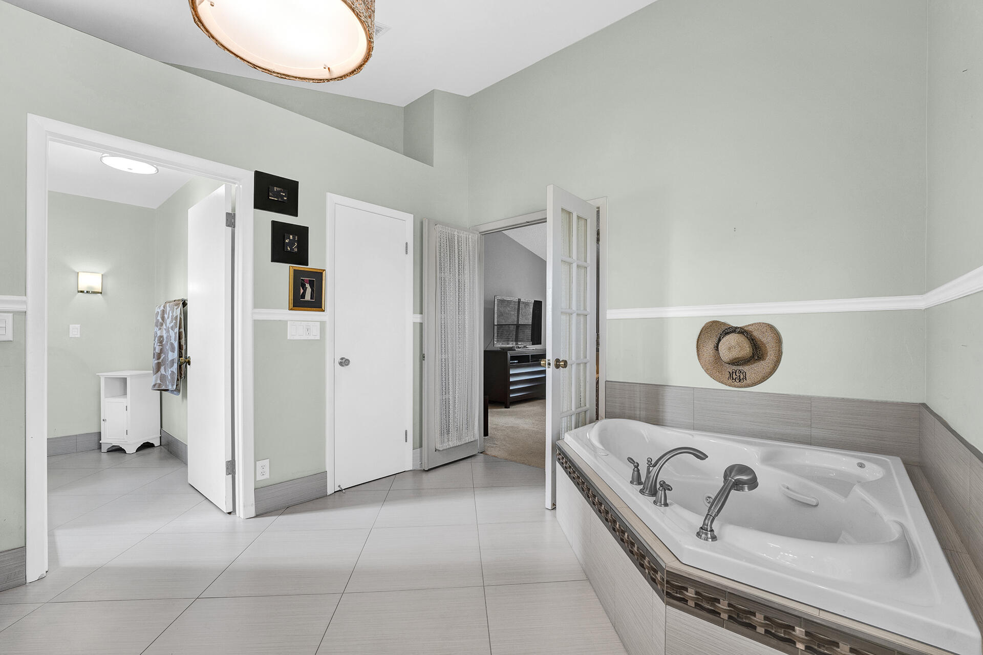 22211 Clocktower Way Boca Raton, FL 33428 - Photo 25 of 38 a bathroom with a bathtub and a sink