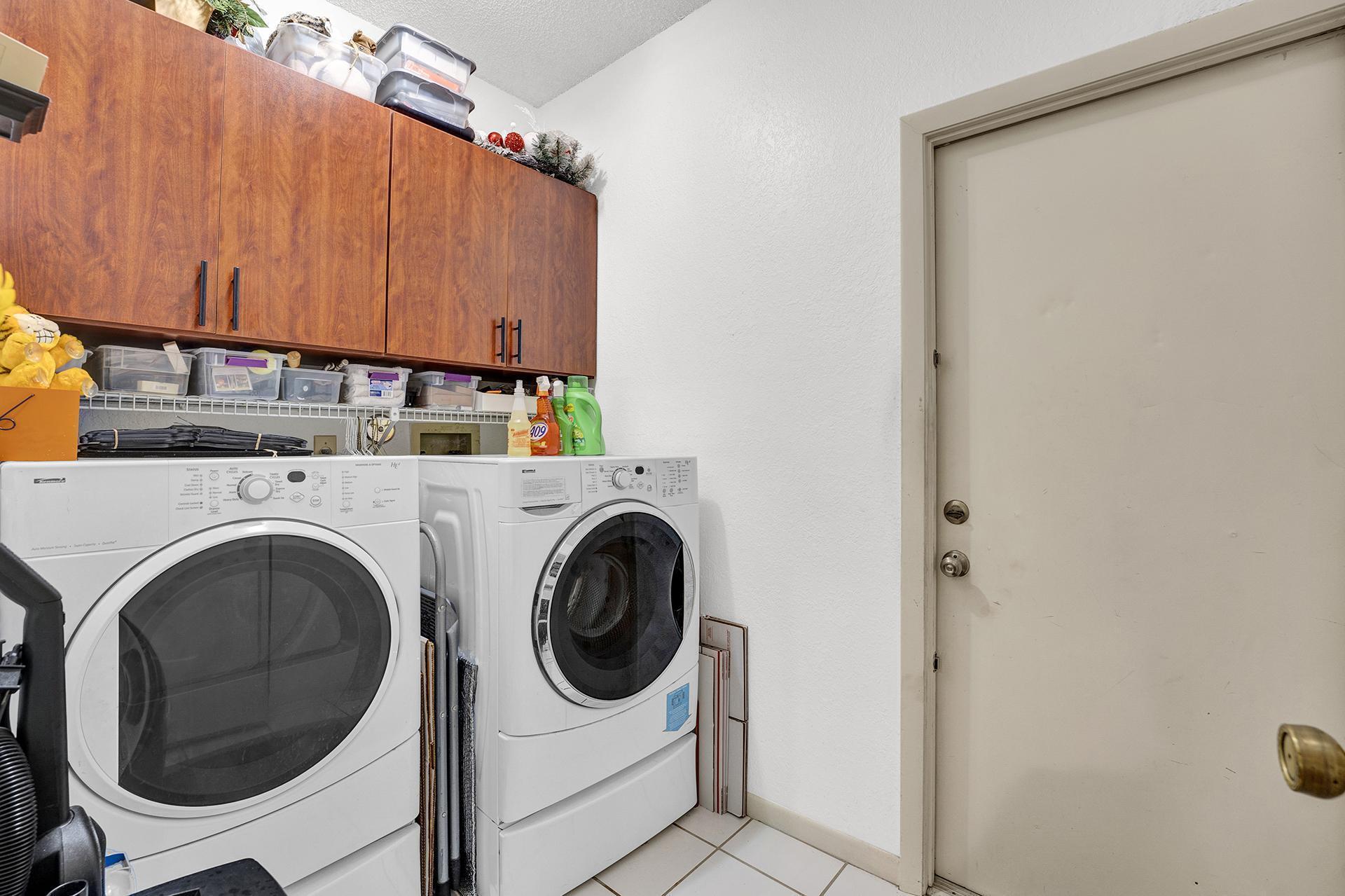 22211 Clocktower Way Boca Raton, FL 33428 - Photo 28 of 38 a view of a utility room with dryer and washer