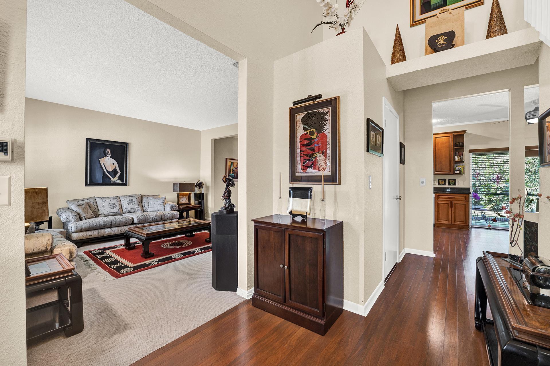 22211 Clocktower Way Boca Raton, FL 33428 - Photo 6 of 38 a living room with furniture and wooden floor